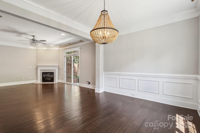 907 Ospre Ln, Fort Mill, SC 29708 - unfurnished living room featuring a premium fireplace, ornamental molding, ceiling fan with notable chandelier, and dark wood-type flooring