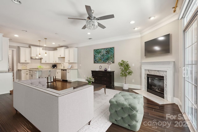 907 Ospre Ln, Fort Mill, SC 29708 - living room featuring ornamental molding, ceiling fan, and dark wood-type flooring