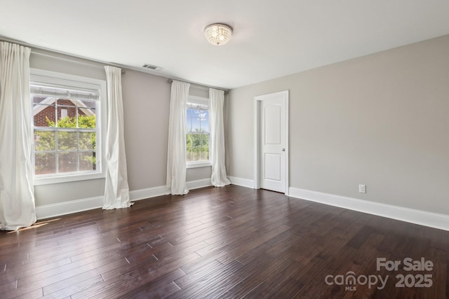 907 Ospre Ln, Fort Mill, SC 29708 - spare room featuring baseboards, dark wood-style flooring, a healthy amount of sunlight, and visible vents