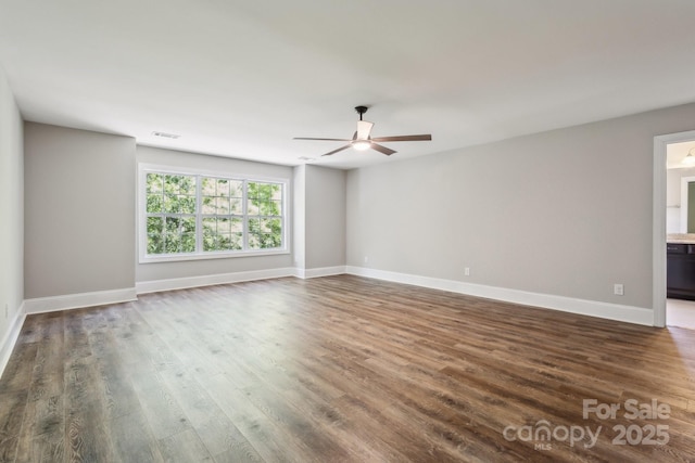 907 Ospre Ln, Fort Mill, SC 29708 - unfurnished room featuring baseboards, dark wood-style flooring, visible vents, and ceiling fan