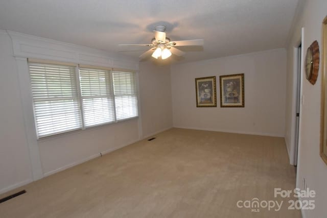 902 Church St NW, Valdese, NC 28690 - unfurnished room with visible vents, baseboards, ceiling fan, and light carpet