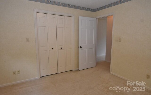 902 Church St NW, Valdese, NC 28690 - unfurnished bedroom with baseboards and a closet