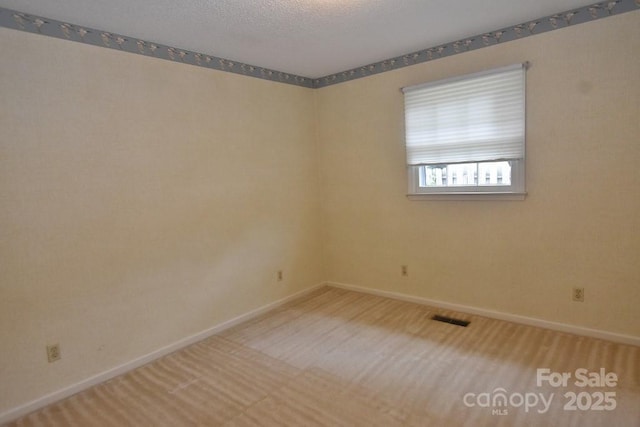 902 Church St NW, Valdese, NC 28690 - carpeted spare room featuring baseboards and visible vents