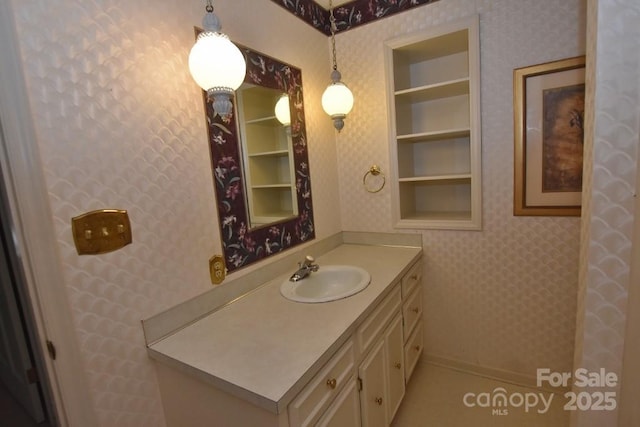 902 Church St NW, Valdese, NC 28690 - bathroom featuring vanity and wallpapered walls