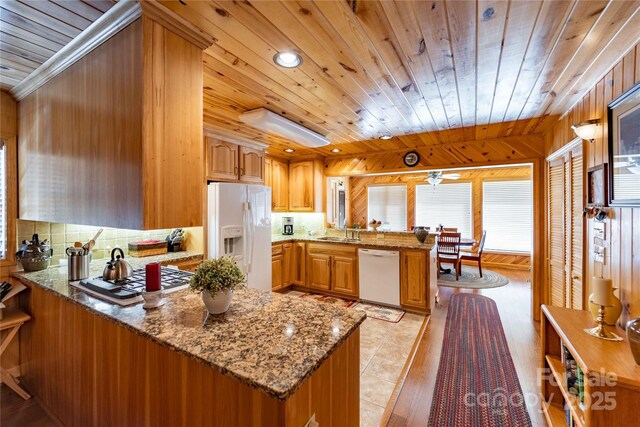 1053 Rich Hill Mountain Rd, Glade Valley, NC 28627 - kitchen featuring decorative backsplash, a peninsula, white appliances, and wooden ceiling