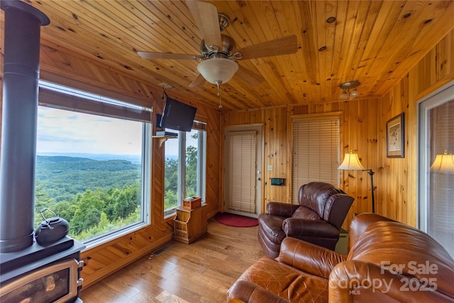 1053 Rich Hill Mountain Rd, Glade Valley, NC 28627 - living room with light wood-style floors, wood walls, ceiling fan, and wooden ceiling