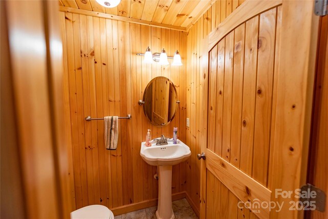 1053 Rich Hill Mountain Rd, Glade Valley, NC 28627 - half bath with a sink, wood walls, wood ceiling, and toilet
