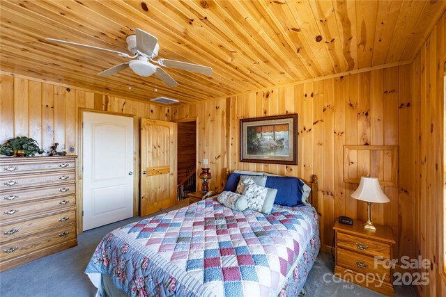 1053 Rich Hill Mountain Rd, Glade Valley, NC 28627 - bedroom with wooden walls, wood ceiling, a ceiling fan, and carpet flooring