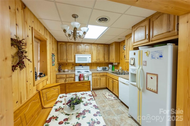 1053 Rich Hill Mountain Rd, Glade Valley, NC 28627 - kitchen featuring a notable chandelier, a sink, white appliances, light countertops, and a paneled ceiling