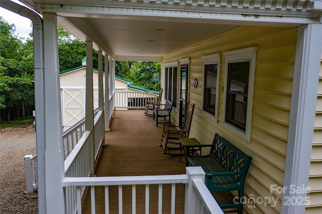 1053 Rich Hill Mountain Rd, Glade Valley, NC 28627 - wooden terrace with a porch, an outdoor structure, and a storage shed