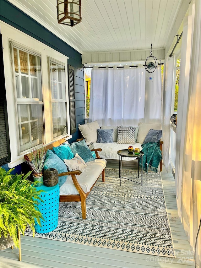 sunroom featuring wood finished floors
