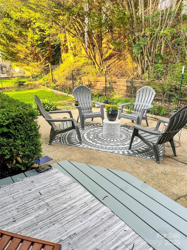 deck featuring fence and a patio