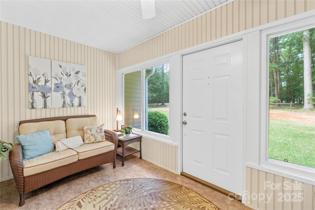 sitting room with wallpapered walls