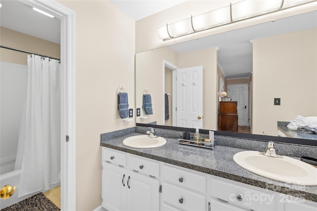 bathroom featuring double vanity and shower / bathtub combination with curtain