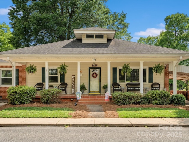 170 8th Ave, Cramerton, NC 28032 - bungalow-style house with a porch, a shingled roof, and brick siding