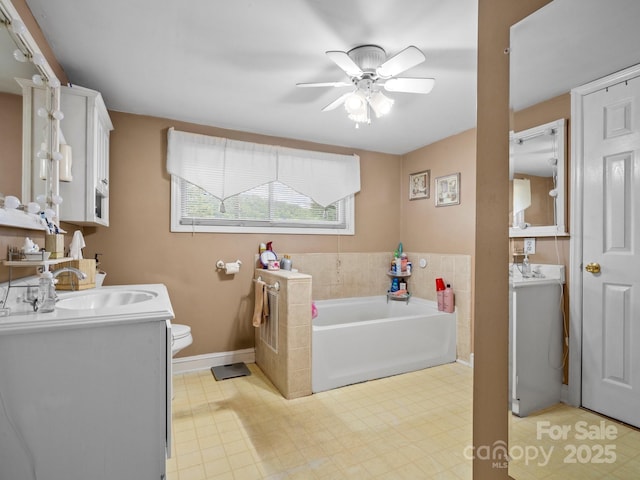 170 8th Ave, Cramerton, NC 28032 - full bathroom featuring double vanity, a bath, ceiling fan, and baseboards