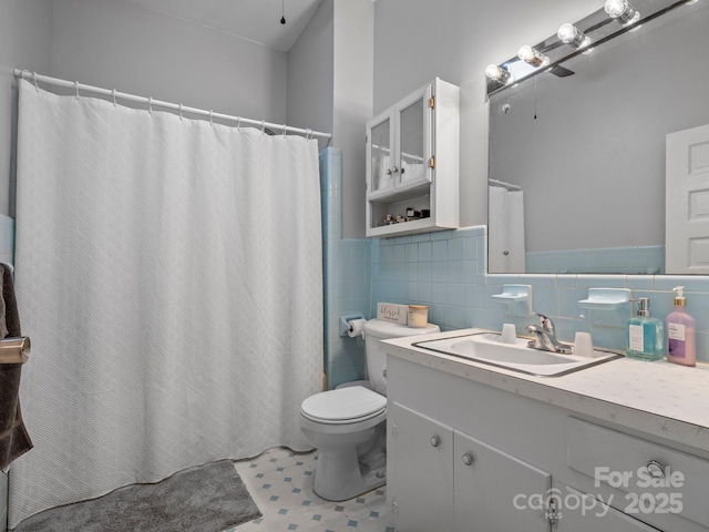 170 8th Ave, Cramerton, NC 28032 - bathroom featuring vanity, toilet, tile walls, a wainscoted wall, and a shower with shower curtain