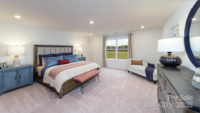 bedroom with light colored carpet and recessed lighting