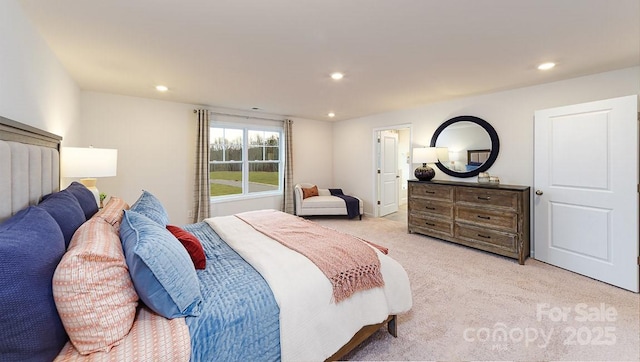 bedroom featuring light carpet and recessed lighting