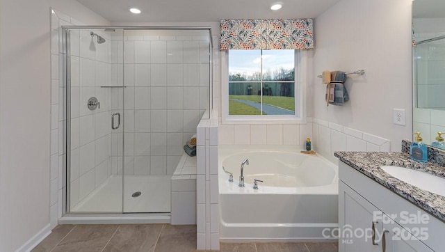 full bath with vanity, recessed lighting, a bath, and a stall shower