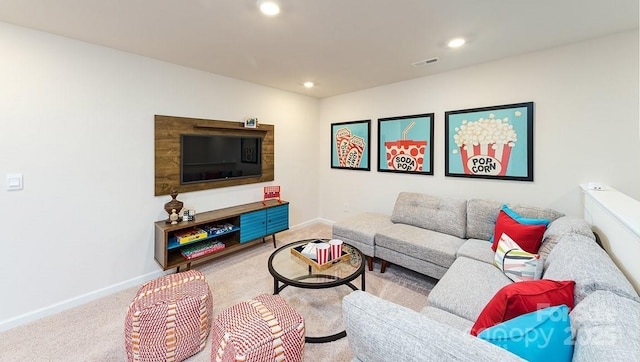 carpeted living area with baseboards, recessed lighting, and visible vents