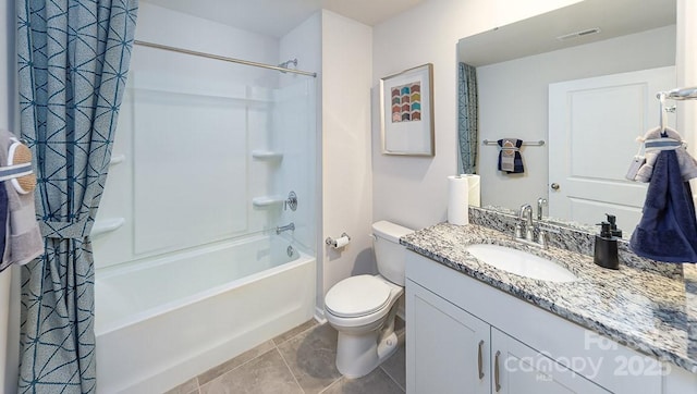 bathroom featuring tile patterned flooring, vanity, toilet, shower / bath combo with shower curtain, and visible vents