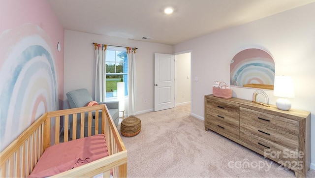 bedroom featuring baseboards, visible vents, and light colored carpet