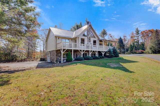 969 Twin Bridges Dr, Fleetwood, NC 28626 - exterior space with stone siding, driveway, a yard, metal roof, and a wooden deck