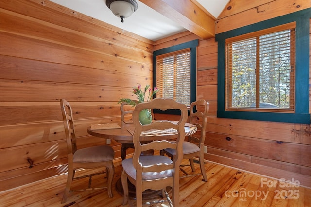 969 Twin Bridges Dr, Fleetwood, NC 28626 - dining area with wooden walls and light wood finished floors