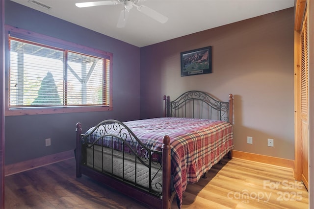 969 Twin Bridges Dr, Fleetwood, NC 28626 - bedroom with baseboards, visible vents, a ceiling fan, and wood finished floors