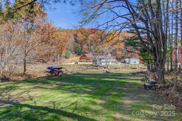 969 Twin Bridges Dr, Fleetwood, NC 28626 - view of yard with a forest view and a water view