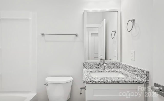 full bath featuring vanity and toilet