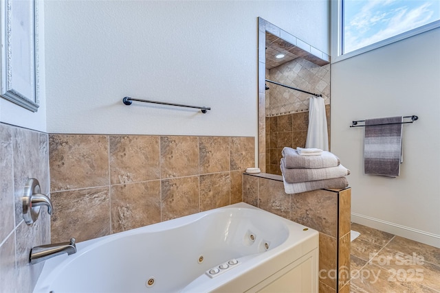 full bath featuring a whirlpool tub and a tile shower
