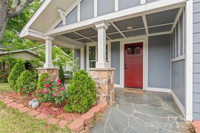 entrance to property featuring a porch