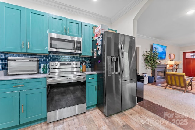 kitchen featuring decorative backsplash, crown molding, light countertops, stainless steel appliances, and light wood-style flooring