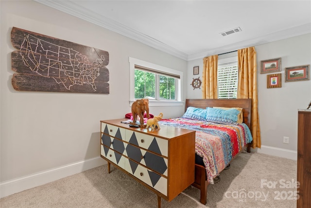 bedroom with carpet floors, baseboards, crown molding, and visible vents