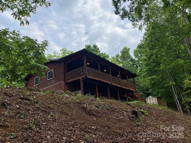 137 Amys Ridge Rd, Lake Lure, NC 28746 - back of property featuring a storage unit, an outbuilding, and a deck
