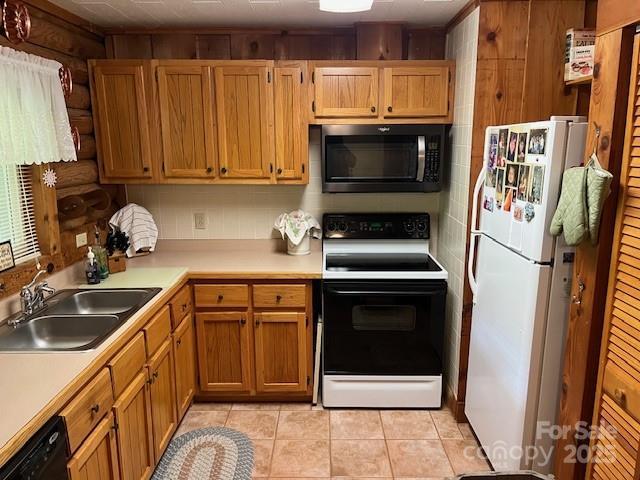 137 Amys Ridge Rd, Lake Lure, NC 28746 - kitchen with range with electric cooktop, dishwasher, a sink, stainless steel microwave, and freestanding refrigerator