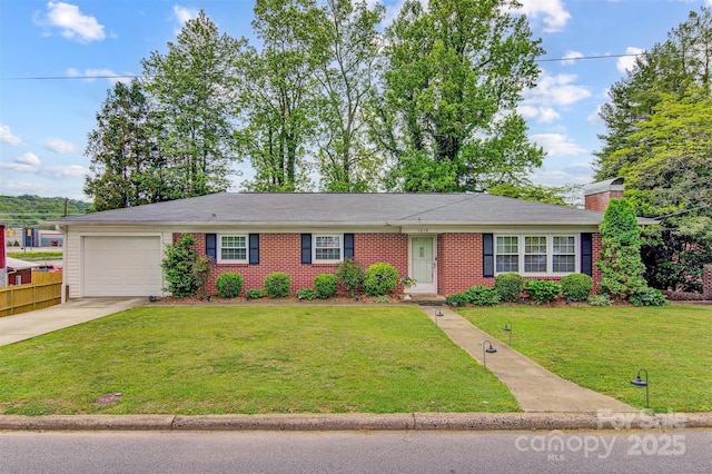 ranch-style house with an attached garage, a front lawn, driveway, and a chimney