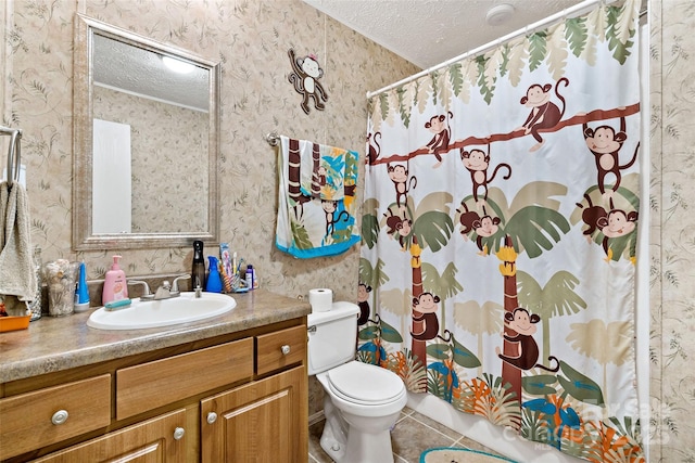 full bath featuring a textured ceiling, wallpapered walls, tile patterned floors, vanity, and toilet