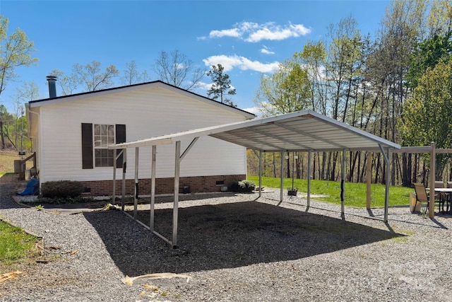 view of home's exterior featuring a carport and crawl space