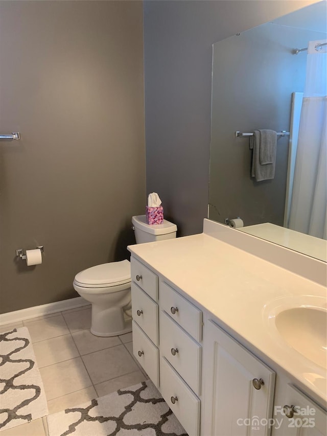 full bathroom featuring toilet, a shower with shower curtain, baseboards, tile patterned flooring, and vanity