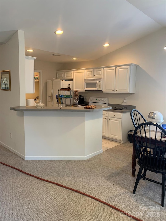 kitchen featuring white cabinets, baseboards, white appliances, light colored carpet, and recessed lighting