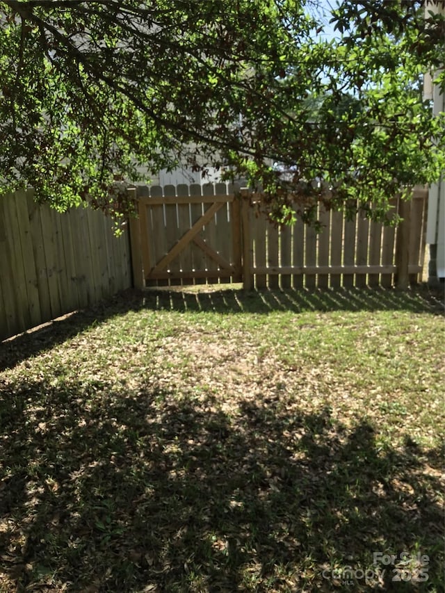 236 35th St NE, Oak Island, NC 28465 - view of yard with fence