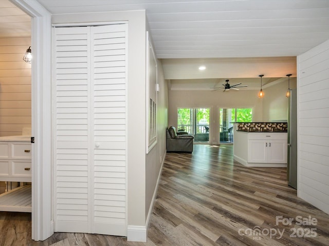 corridor with dark wood-type flooring