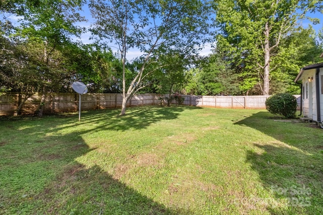 view of yard with a fenced backyard