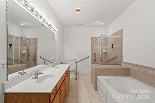 9047 Rosalyn Glen Rd, Cornelius, NC 28031 - full bath featuring a shower stall, a garden tub, tile patterned flooring, double vanity, and toilet