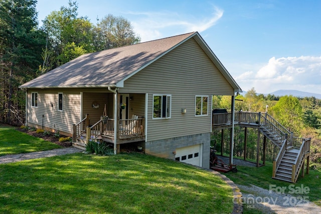 958 Alta Vista Ln, Sparta, NC 28675 - chalet / cabin featuring a shingled roof, stairs, an attached garage, and a front lawn