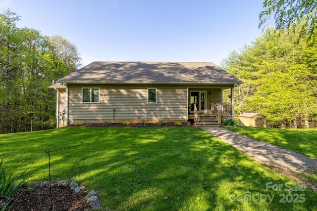 958 Alta Vista Ln, Sparta, NC 28675 - view of front of home with a storage shed, an outbuilding, a porch, and a front lawn