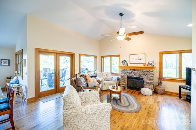958 Alta Vista Ln, Sparta, NC 28675 - living room with a ceiling fan, french doors, a fireplace, wood finished floors, and baseboards